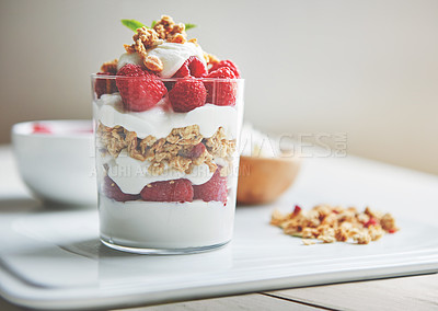 Buy stock photo Breakfast, cereal and yogurt with raspberry on plate for vegan food, health and protein in morning. Vitamins, glass and dairy in clear container with fruit for organic nutrition, weight loss and diet