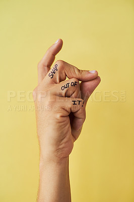 Buy stock photo Studio shot of an unrecognizable man snapping his fingers against a yellow background