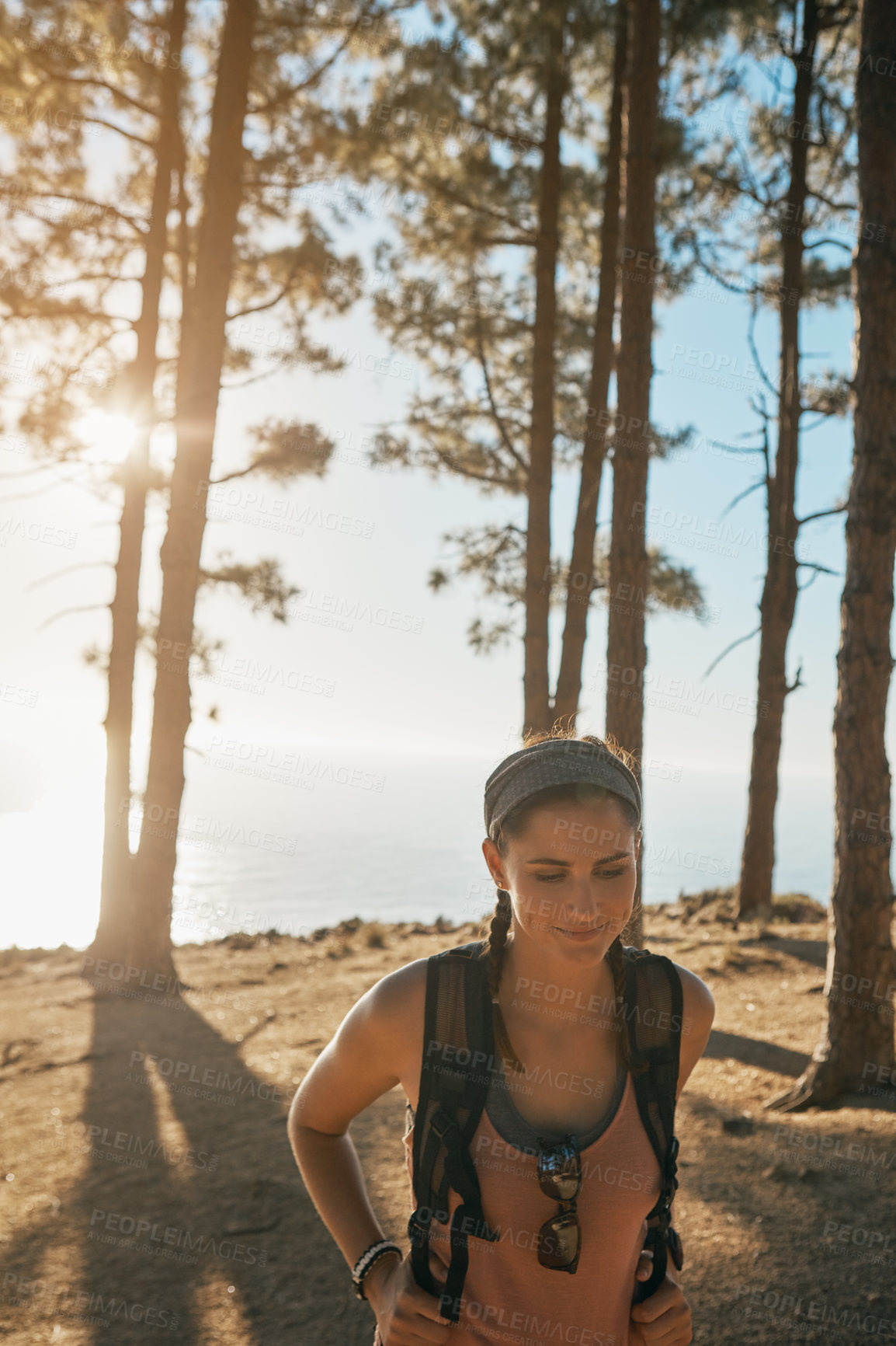 Buy stock photo Shot of a young woman out on a hike in the forest