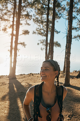 Buy stock photo Shot of a young woman out on a hike in the forest