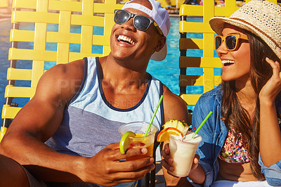 Buy stock photo Couple, bonding and swimming pool with happiness and cocktails at resort for fun with sunshine. Drinks, summer and girl or boy at poolside for vacation to relax with smile or couple, tanning.