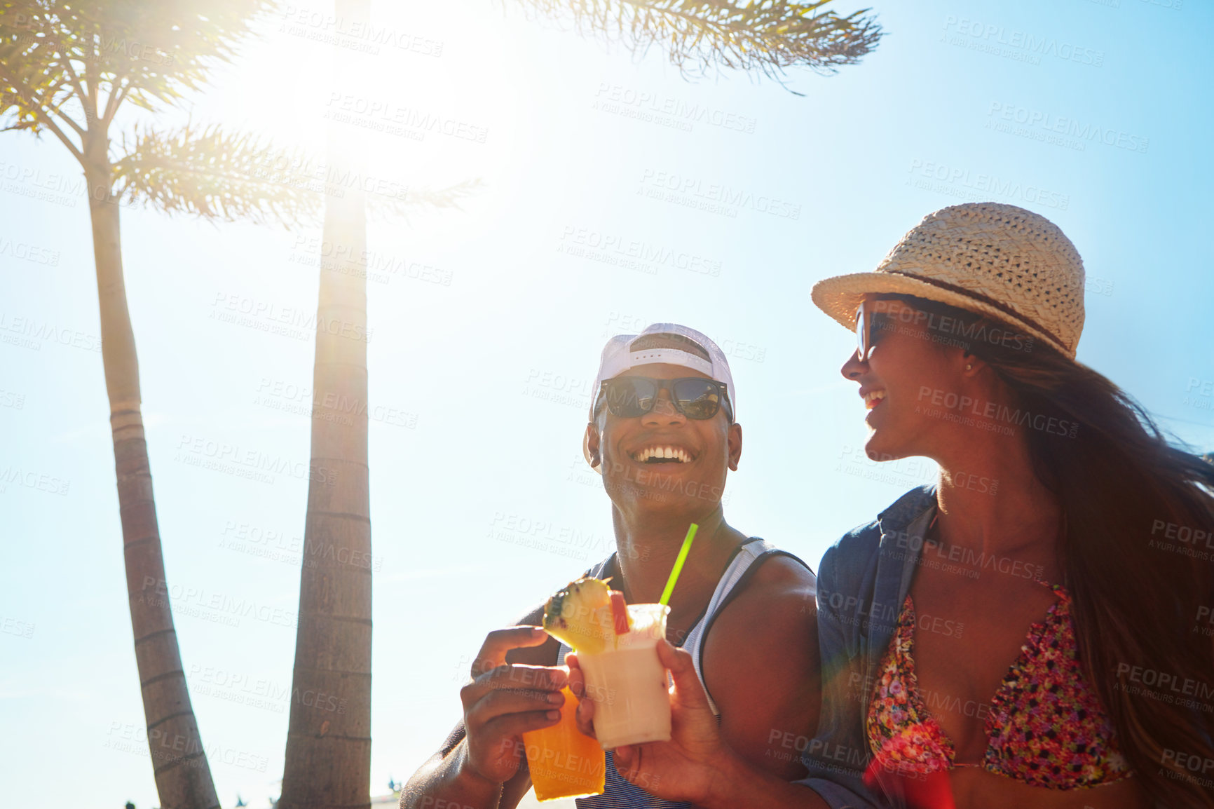 Buy stock photo Cropped shot of an affectionate young couple spending a summer’s day outdoors