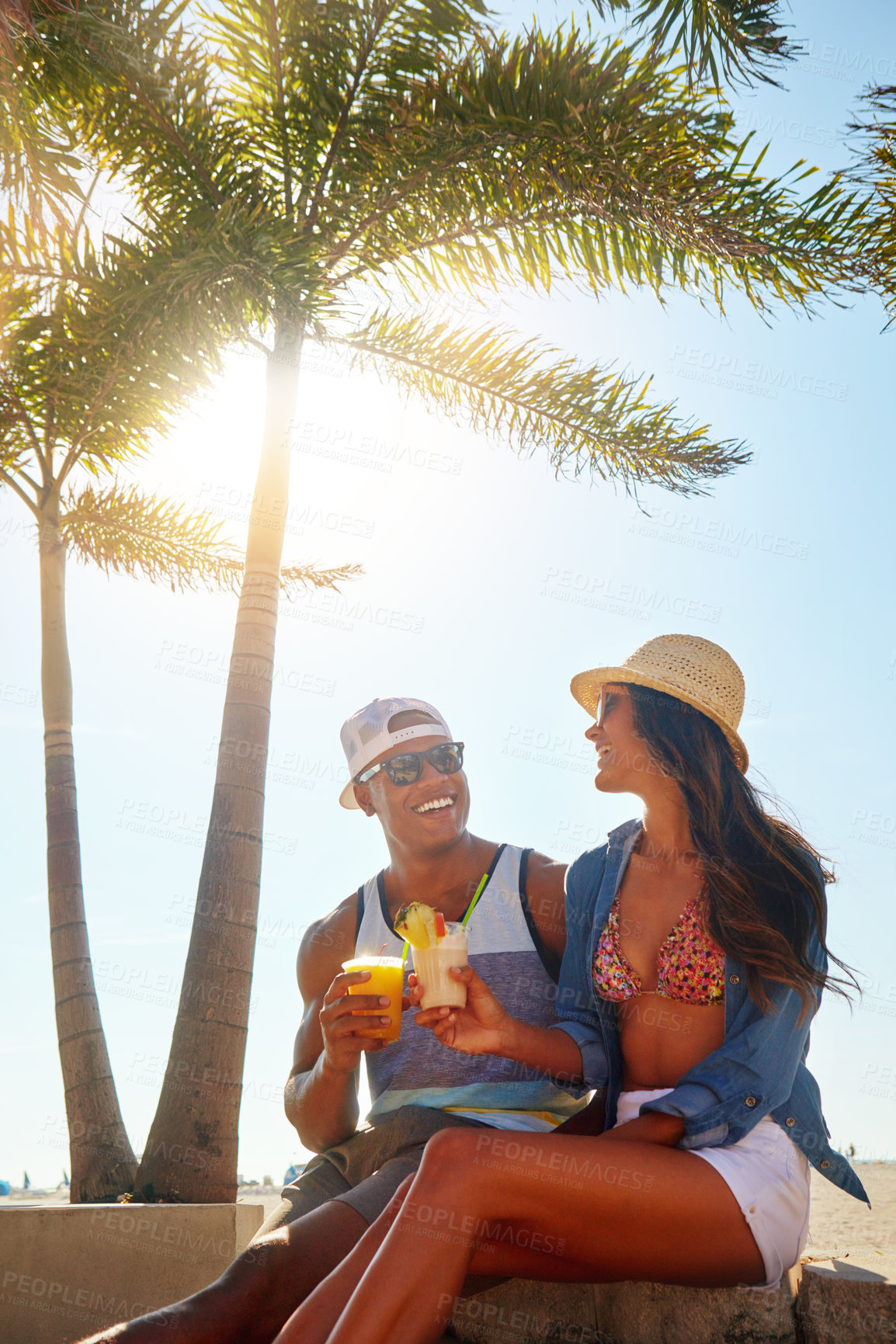 Buy stock photo Cropped shot of an affectionate young couple spending a summer’s day outdoors