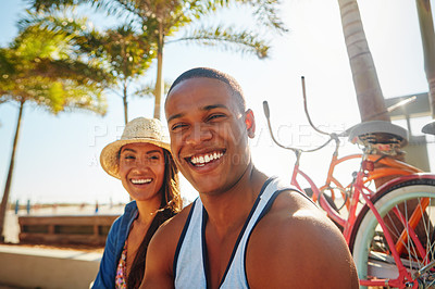 Buy stock photo Cropped shot of an affectionate young couple spending a summer’s day outdoors