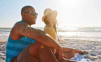 Buy stock photo Couple, picnic and happy at beach with sunglasses, sunset and relax for vacation by ocean in summer. Man, woman and smile on sand in California with sky, sun and partner on date for holiday or love