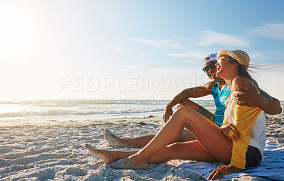 Buy stock photo Couple, picnic and hug at beach with sunglasses, sunset and relax for vacation by ocean in summer. Man, woman and happy on sand in Miami with blue sky, view and partner on date for holiday or love