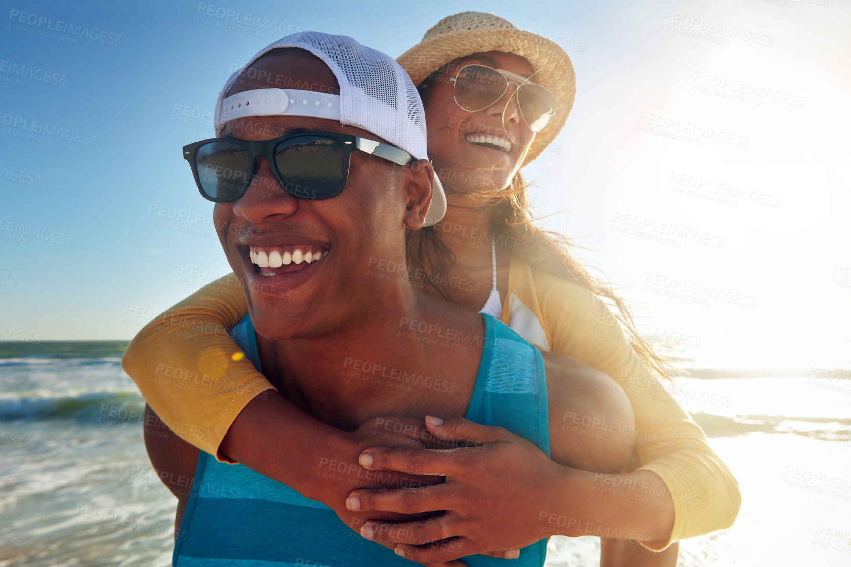 Buy stock photo Happy couple, beach vacation or piggy back, smile with support on holiday for wellness. Man, woman or together with sunglasses by ocean for travel in sunshine, sea or waves on Mauritius island