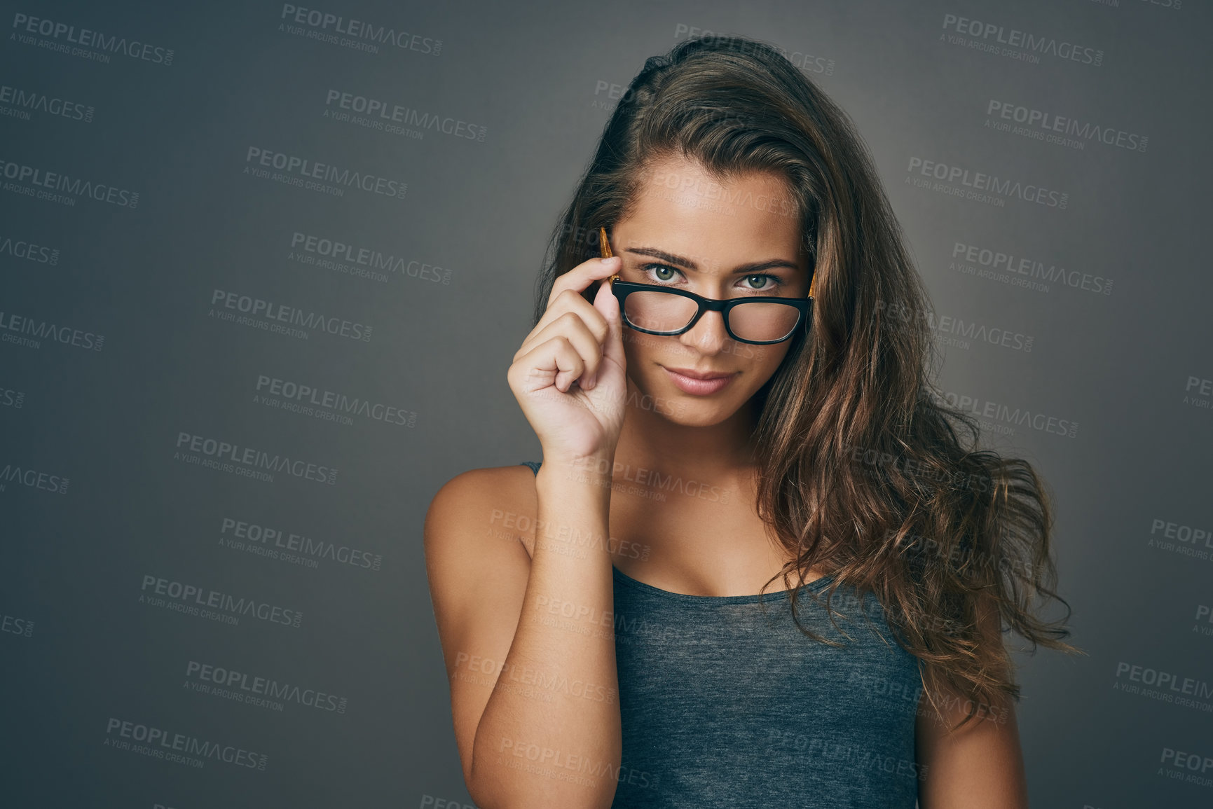 Buy stock photo Woman, portrait and serious with eyeglasses in studio on grey background for prescription, eyewear and eyesight. Female person, satisfied and confident with frame for spectacles, lens and vision