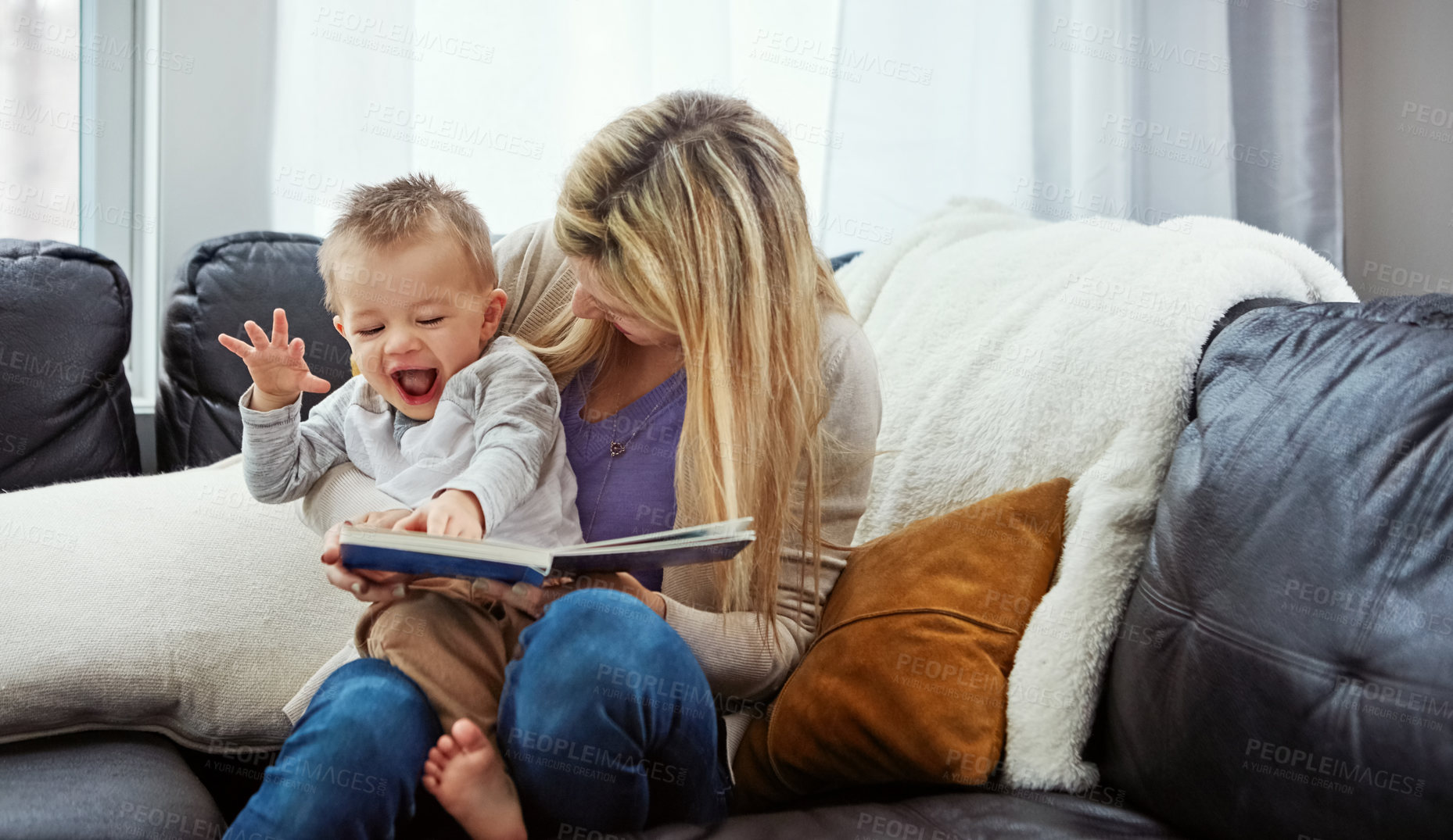 Buy stock photo Reading, mother and boy in living room with book, teaching or learning in family home for education. Excited, fantasy or storytelling, mama and son relax on sofa together with love, care and laughing