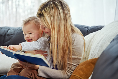 Buy stock photo Reading, mother and son in living room with book, teaching and learning in family home and education. Knowledge, fantasy and storytelling, mama and boy relax on sofa together with love, care and calm