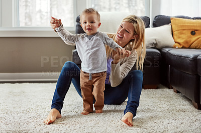 Buy stock photo Baby, mother and development in house with walking or growth of child for first steps in portrait. Toddler, woman and motor skills with help, support and learning from mom for progress or balance