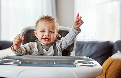 Buy stock photo Baby, high chair and home with happiness for learning or wellness, motor skills with finger for development. Young, boy child and hand in house for healthy growth, waiting for meal time in apartment