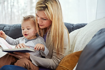 Buy stock photo Reading, mother and boy on sofa with book, teaching and learning in family home and education. Knowledge, fantasy and storytelling, mama and son relax in living room together with love, care and calm