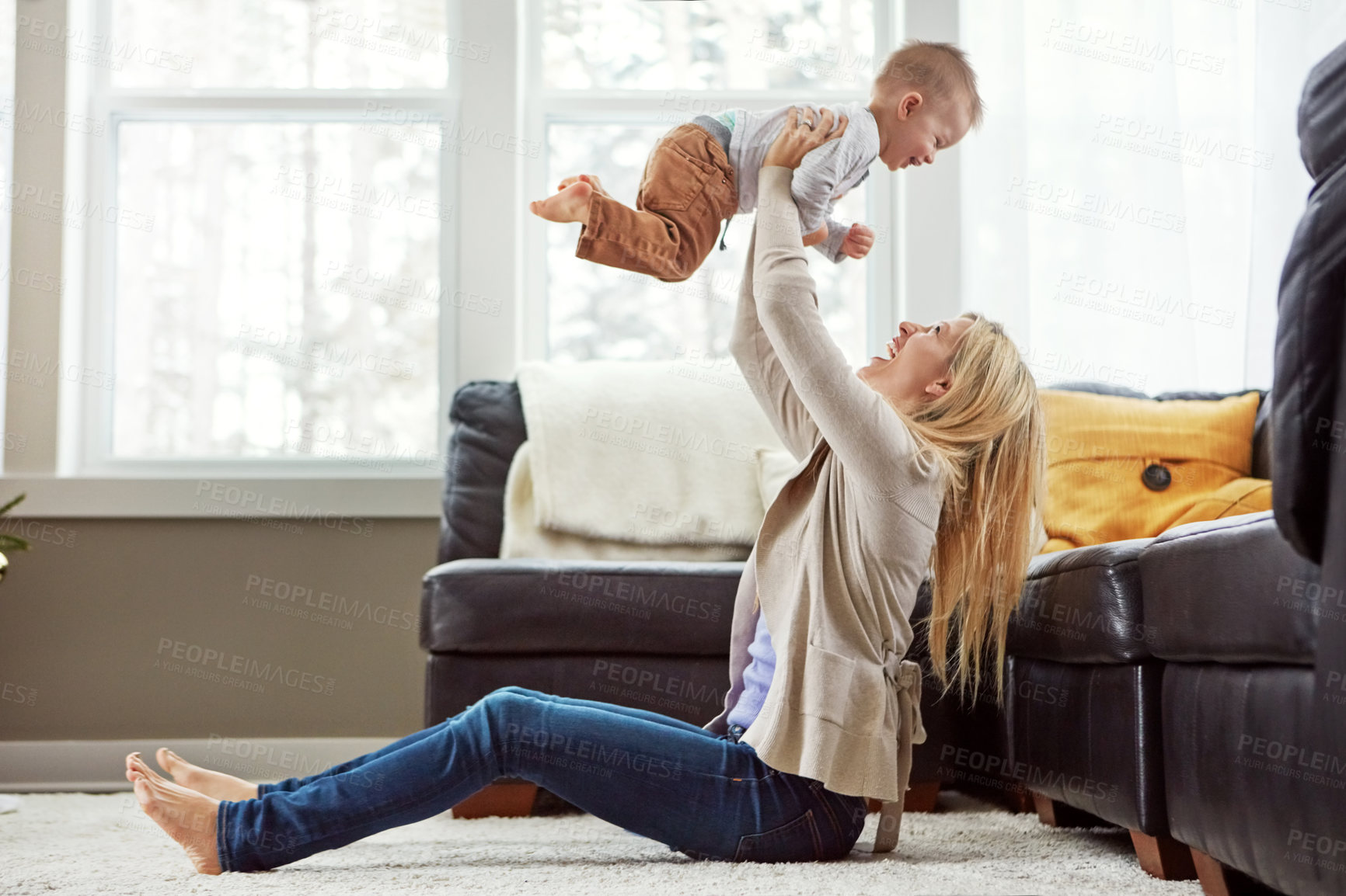 Buy stock photo House, air and kiss of baby, mom and lounge for bonding with son, morning and love in apartment. Home, mother and toddler in living room, playful and together on floor, happiness and care for boy