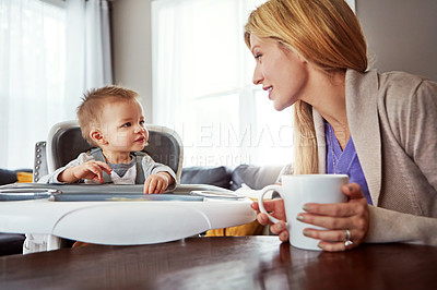 Buy stock photo Shot of a mother bonding with her baby boy at home