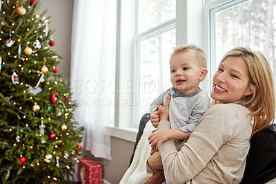 Buy stock photo Shot of a young mother enjoying Christmas with her little boy