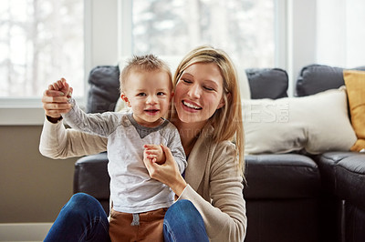 Buy stock photo Baby, mother and development in house with walking or growth of child for first steps in portrait. Toddler, woman and motor skills with learning, help and support from mom for progress or balance