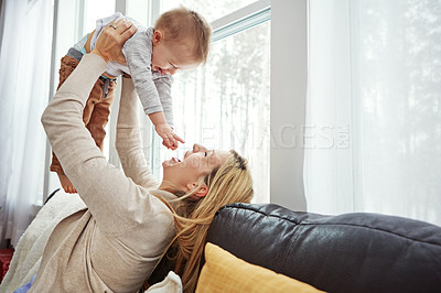 Buy stock photo Couch, playing and  baby with mom, lounge and bonding with son, morning and love in apartment. Home, mother and toddler in living room, laughing and together on sofa, happiness and care for boy