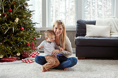 Buy stock photo Mom, boy and portrait on floor at Christmas with tree, bonding and care with connection in family home. Woman, mother and toddler on lounge carpet for games, love and festive celebration in morning