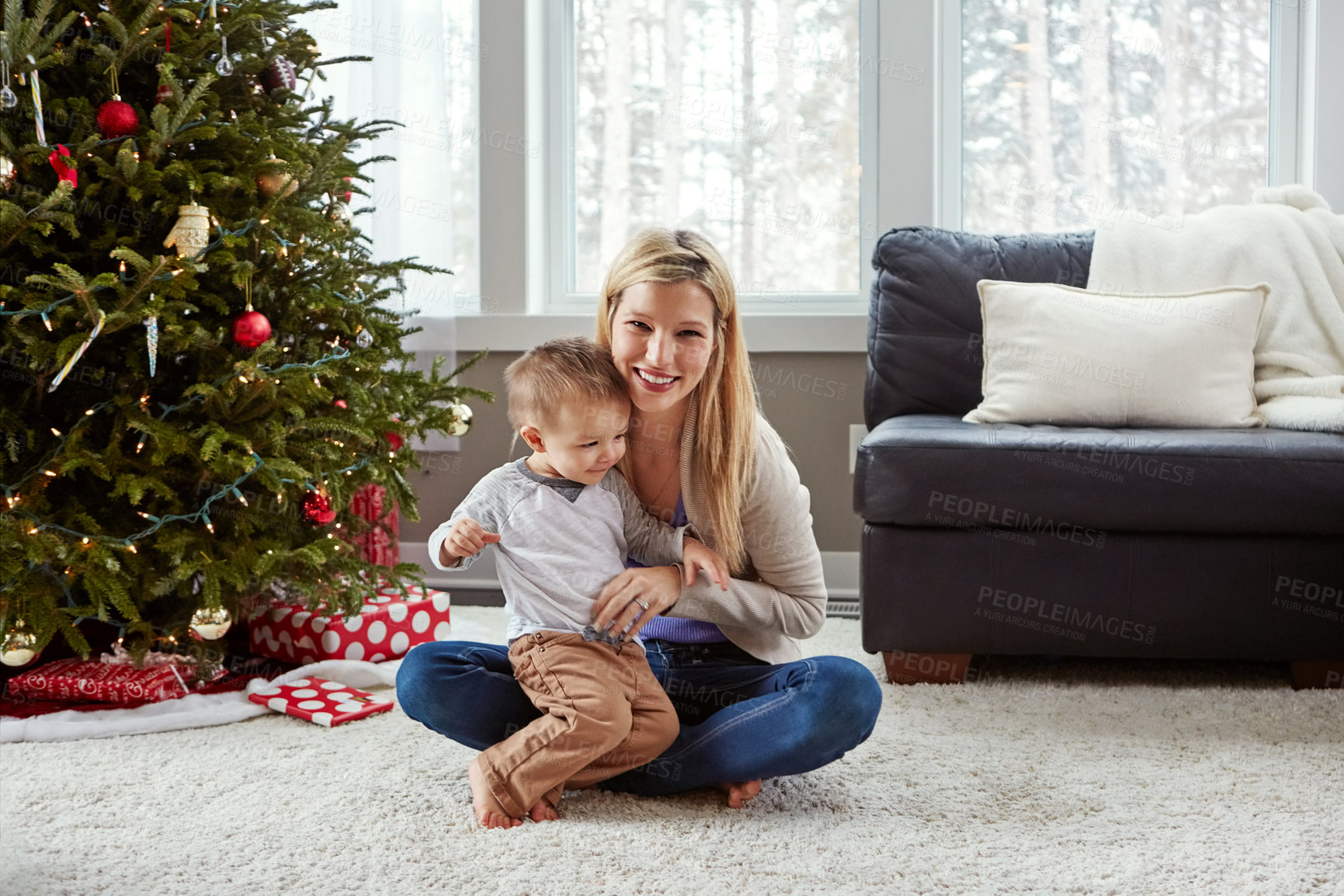 Buy stock photo Mom, boy and portrait on floor at Christmas with tree, bonding and care with connection in family home. Woman, mother and toddler on lounge carpet for games, love and festive celebration in morning