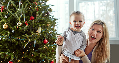 Buy stock photo Portrait, baby and happy with mother in living room, holding hands for love and christmas holiday. Smile, motherhood and toddler by woman together, hug and play by sitting for relationship at home