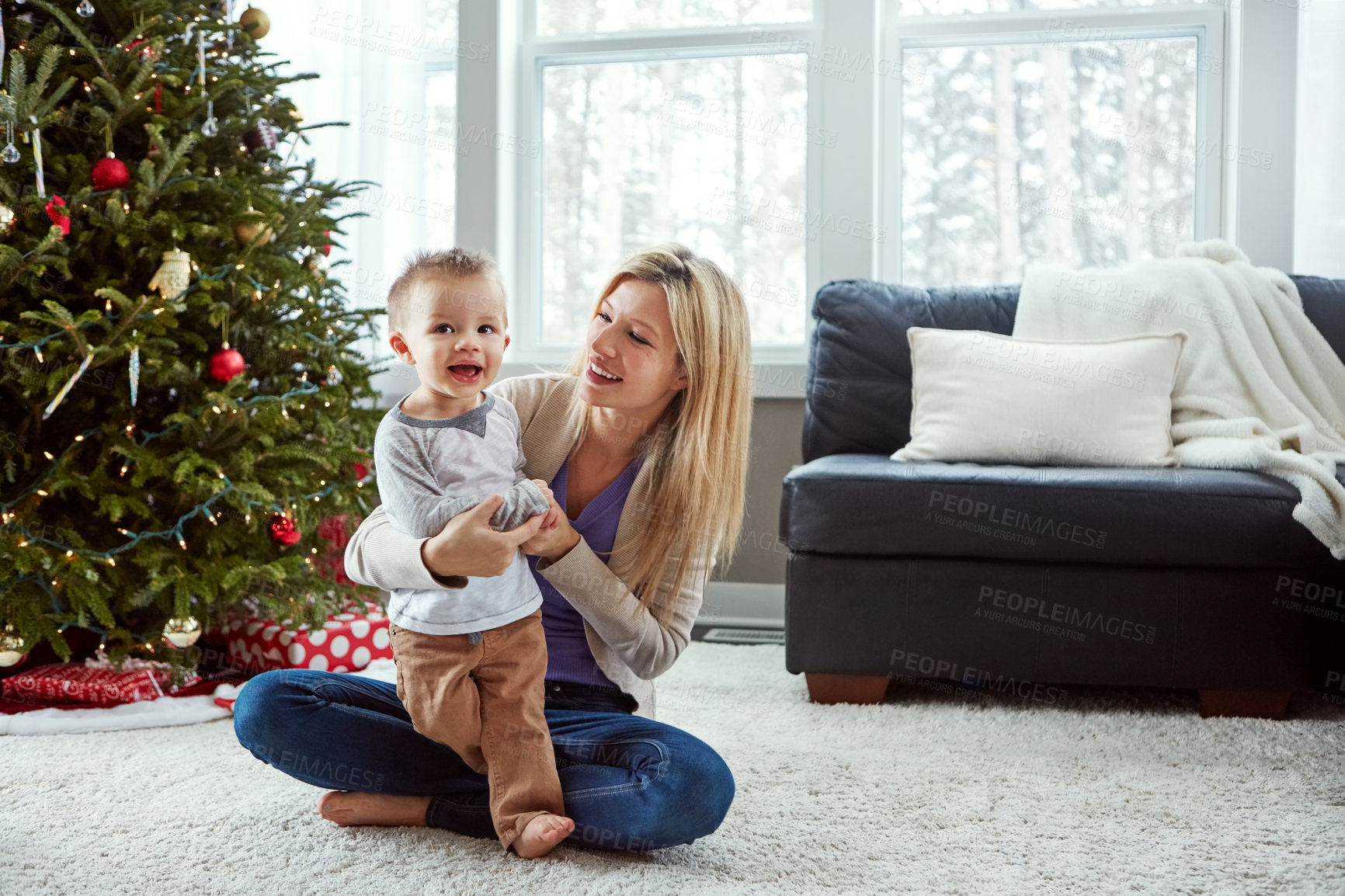 Buy stock photo Smile, woman and christmas with child in living room by mother, play and laugh for bonding together. Love, laughing with baby or family sit on floor, motherhood happiness and hugs for toddler at home