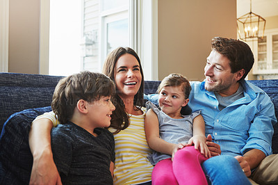 Buy stock photo Shot of a happy family bonding together at home