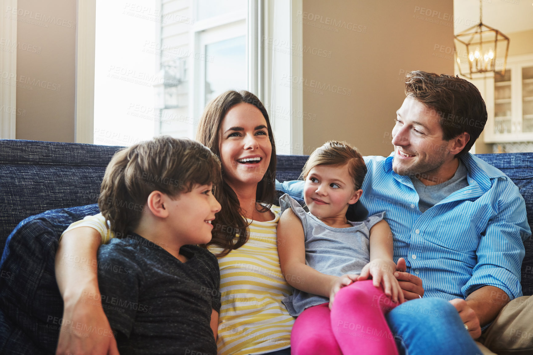 Buy stock photo Shot of a happy family bonding together at home