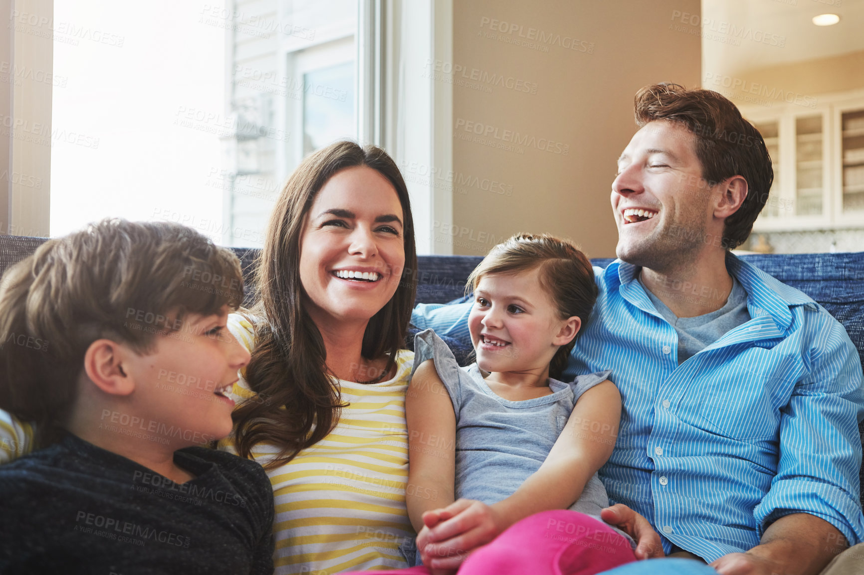 Buy stock photo Shot of a happy family bonding together at home