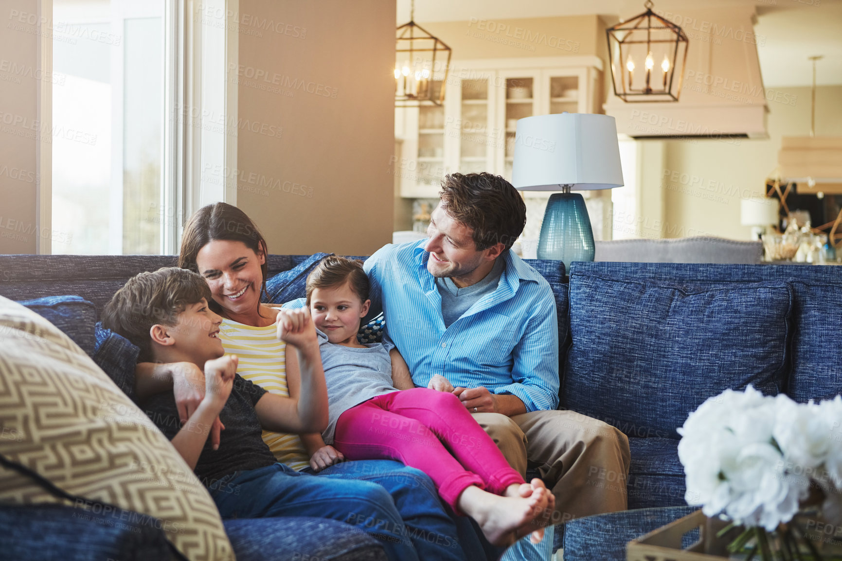 Buy stock photo Shot of a happy family bonding together at home