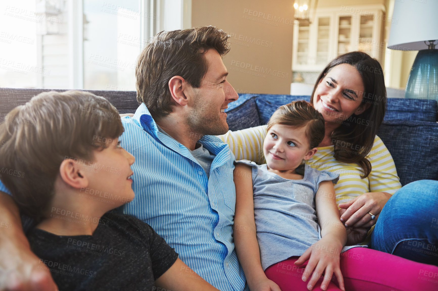 Buy stock photo Shot of a happy family bonding together at home