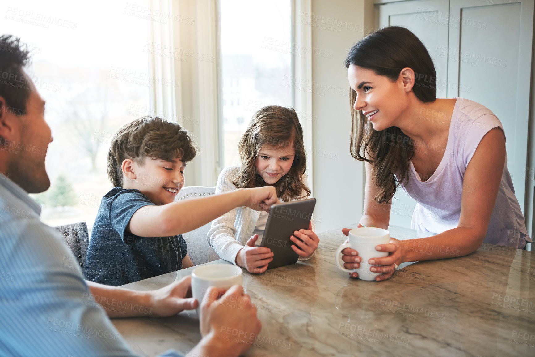Buy stock photo Home, parents and kids with tablet, support and bonding together with teaching app. Family, smile and mother with father, education and website info for child development, elearning and online tutor