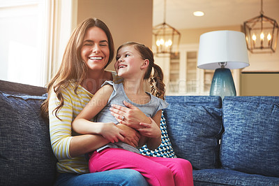 Buy stock photo Child, woman and hug with love on sofa house for playful, bonding and support of relationship moment. Smile, mother and girl as family for care, security or relax with embrace on couch for childhood