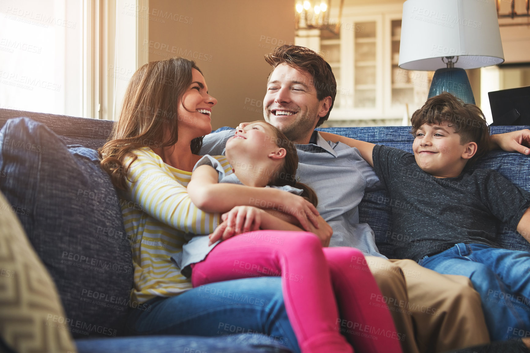 Buy stock photo Shot of a happy family bonding together at home