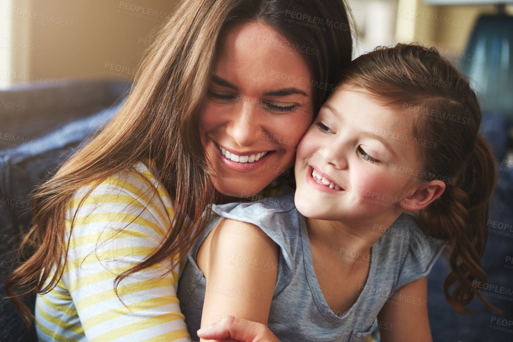 Buy stock photo Shot of a mother and her daughter bonding at home