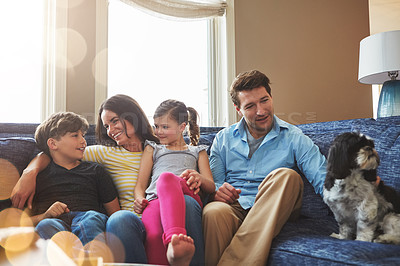 Buy stock photo Shot of a happy family bonding together at home