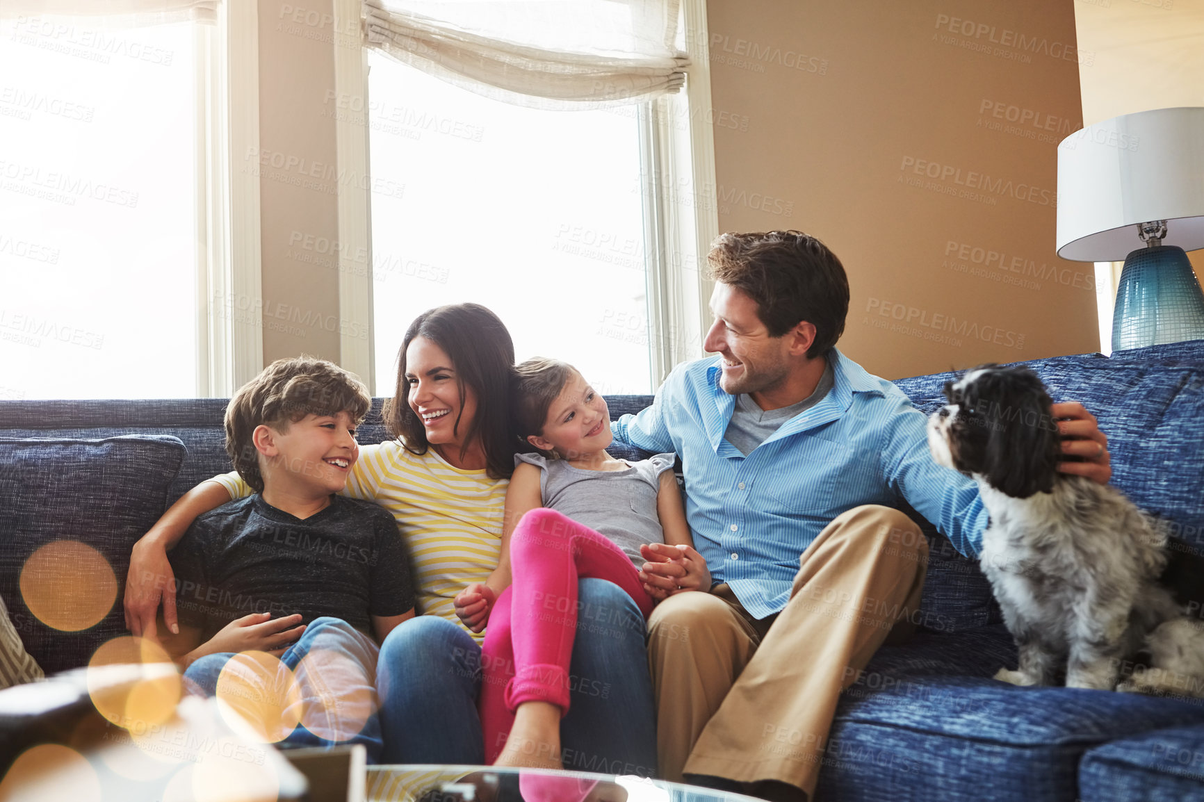 Buy stock photo Shot of a happy family bonding together at home