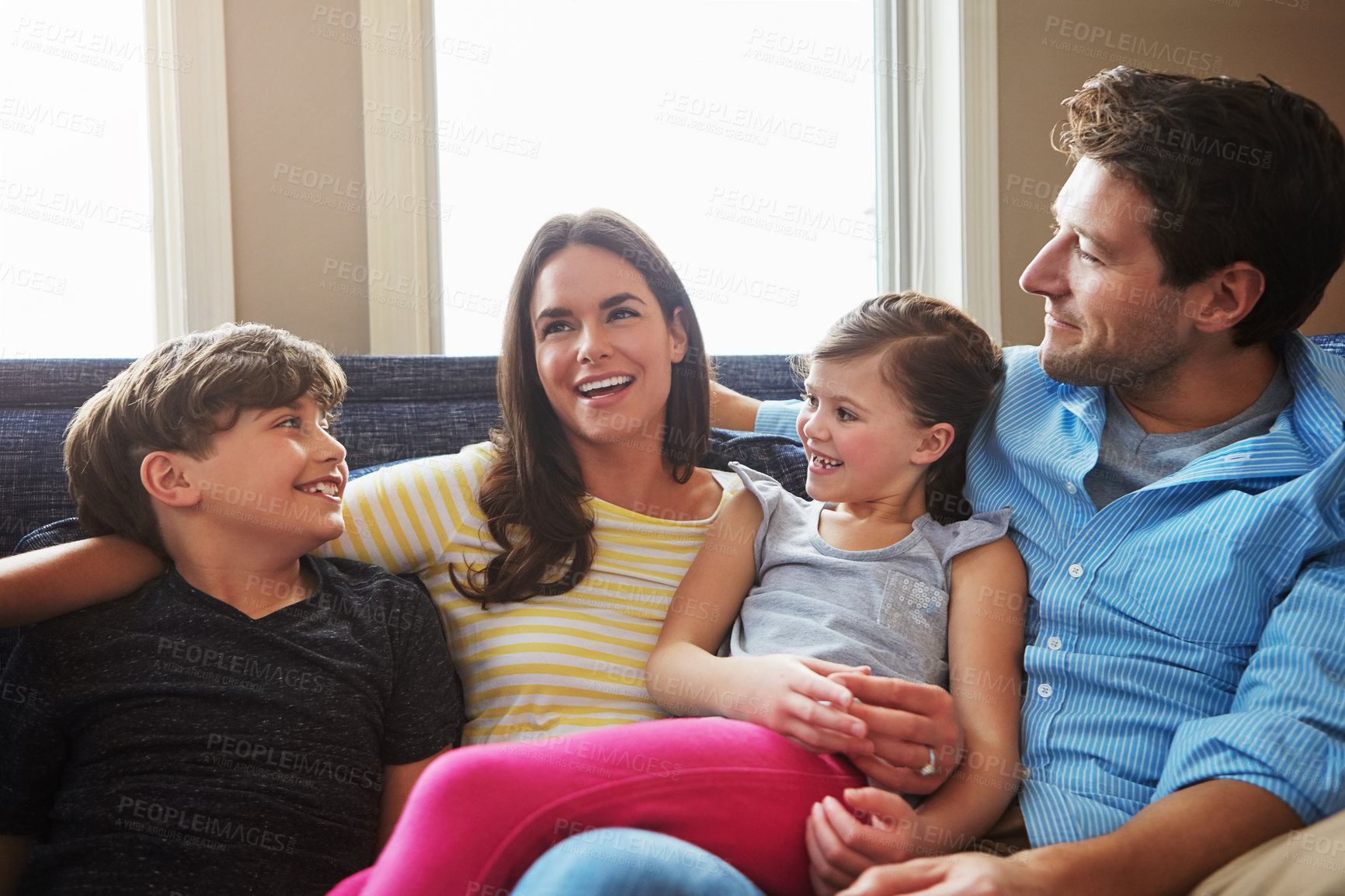 Buy stock photo Shot of a happy family bonding together at home