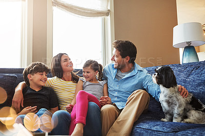 Buy stock photo Shot of a happy family bonding together at home
