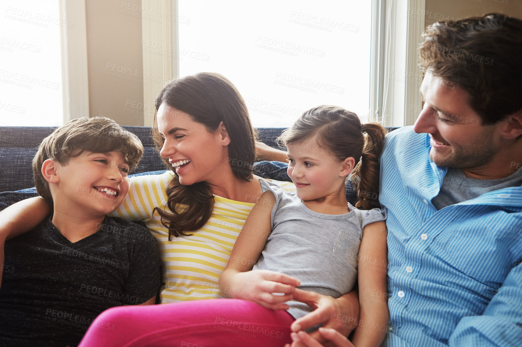 Buy stock photo Shot of a happy family bonding together at home