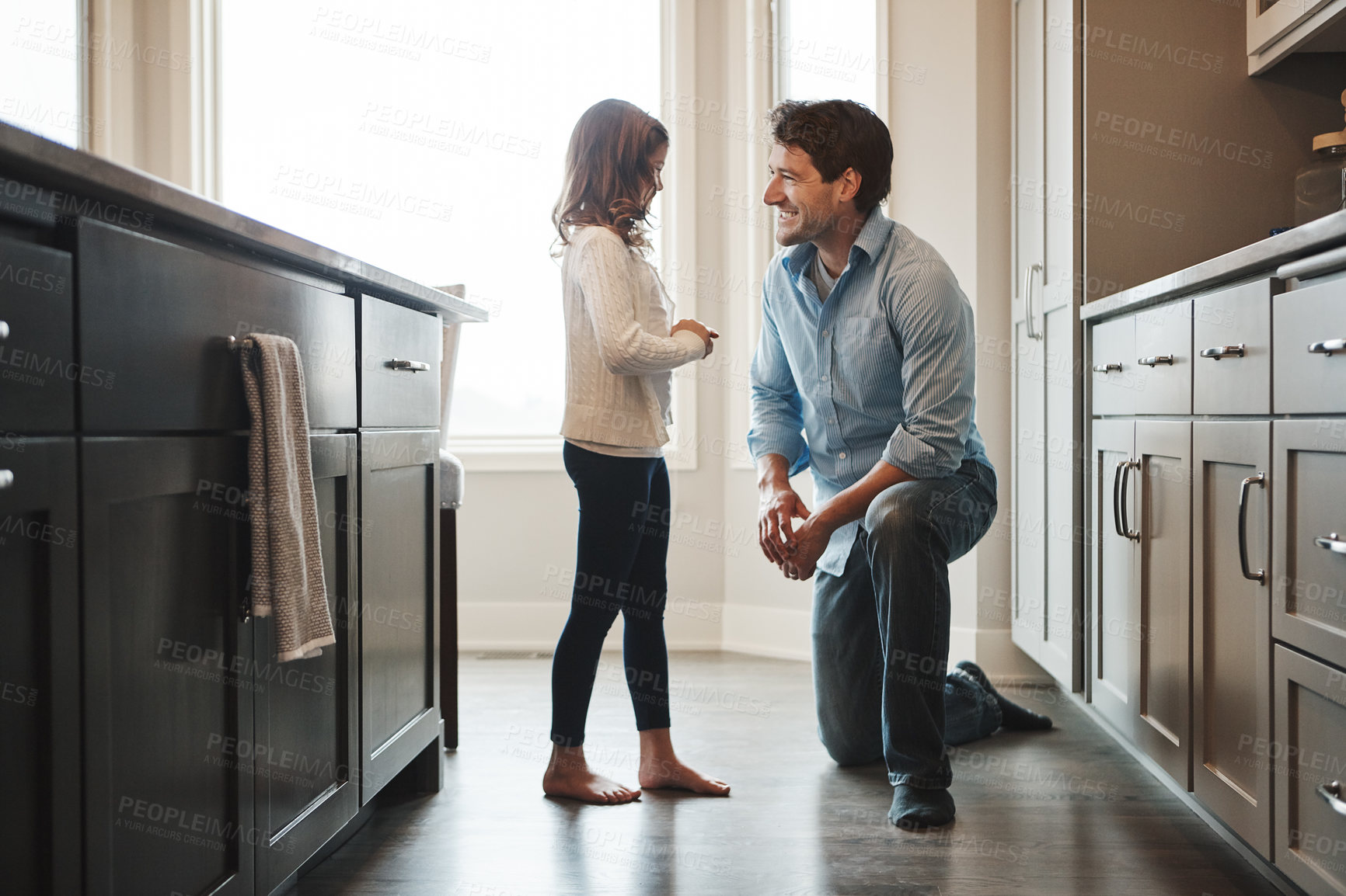 Buy stock photo Father, girl and smile in kitchen for talking, love and support for relationship in home. Man, daughter and together for care or security and happy, speaking and bonding in family house for trust