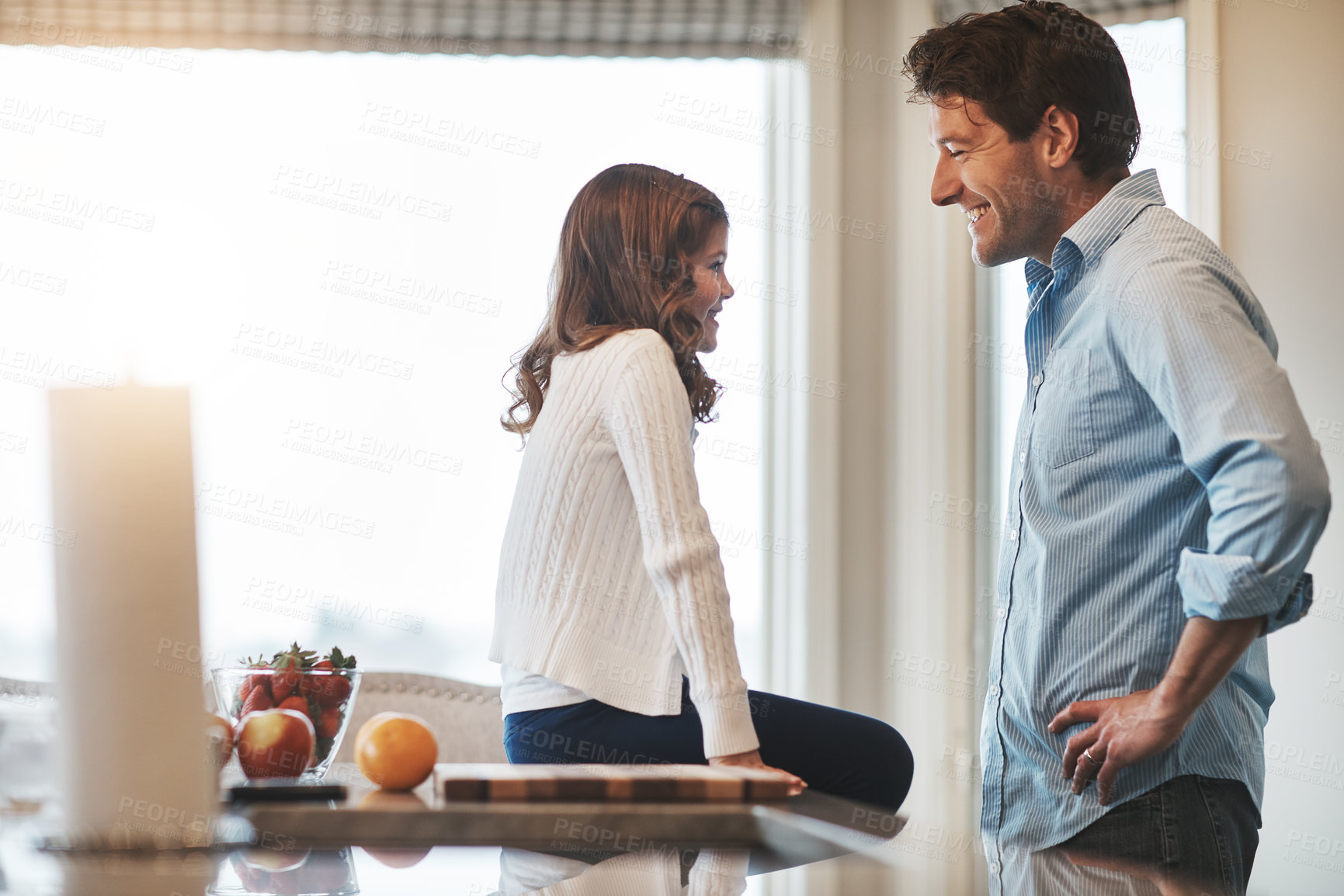 Buy stock photo Father, girl and counter in kitchen for talking, love and support for relationship in home. Daddy, daughter and together for care or security and happy, speaking and bonding in family house for trust