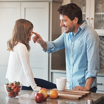 Buy stock photo Father, daughter and nose touch in kitchen for humor, love and support for relationship in home. Daddy, girl and together for care or play game, conversation and bonding in family house for comedy