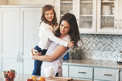 Buy stock photo Love, mother and hug with girl, kitchen counter or bonding in weekend, house and kid with smile. Home, child and mom with daughter, embrace and together in morning, peace or breakfast in apartment