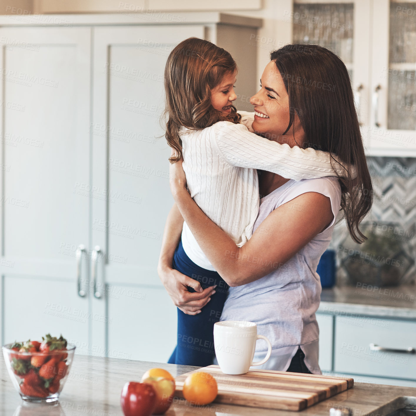 Buy stock photo Care, mom and hug with girl, kitchen or smile in weekend, house and kid with love. Bonding, child and mother with daughter, embrace and together in morning, happy or breakfast in apartment for peace