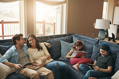 Buy stock photo Family, children and parents on couch, watching tv or streaming on tablet with bonding in living room. Mother, father and kids with electronics, popcorn or movies to relax with show on sofa at house