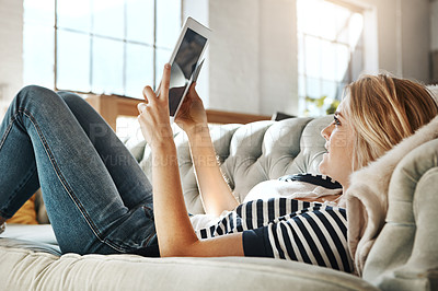 Buy stock photo Woman, tablet and credit card for ecommerce on sofa relaxing in the living room for online purchase at home. Female shopper banking on touchscreen with bank card for purchase, app or sale on couch