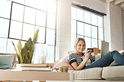 Buy stock photo Laptop, ecommerce and credit card of woman on sofa checking banking information on card for payment. Relaxed girl on home couch happy with online shopping transaction with satisfied smile.