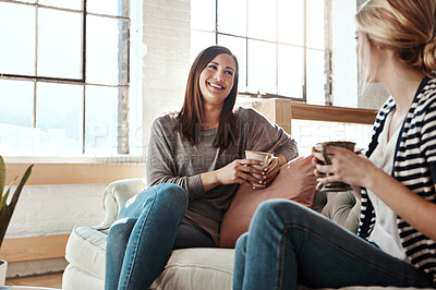 Buy stock photo Happy woman, friends and laughing with coffee on sofa for funny joke, social or discussion in living room at home. Female person with smile for morning, drink or conversation for catch up at house