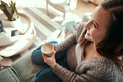 Buy stock photo Happy woman, relax and sofa with coffee for morning, drink or caffeine in living room at home. Top view of female person with smile for beverage, cappuccino or latte on lounge couch at house